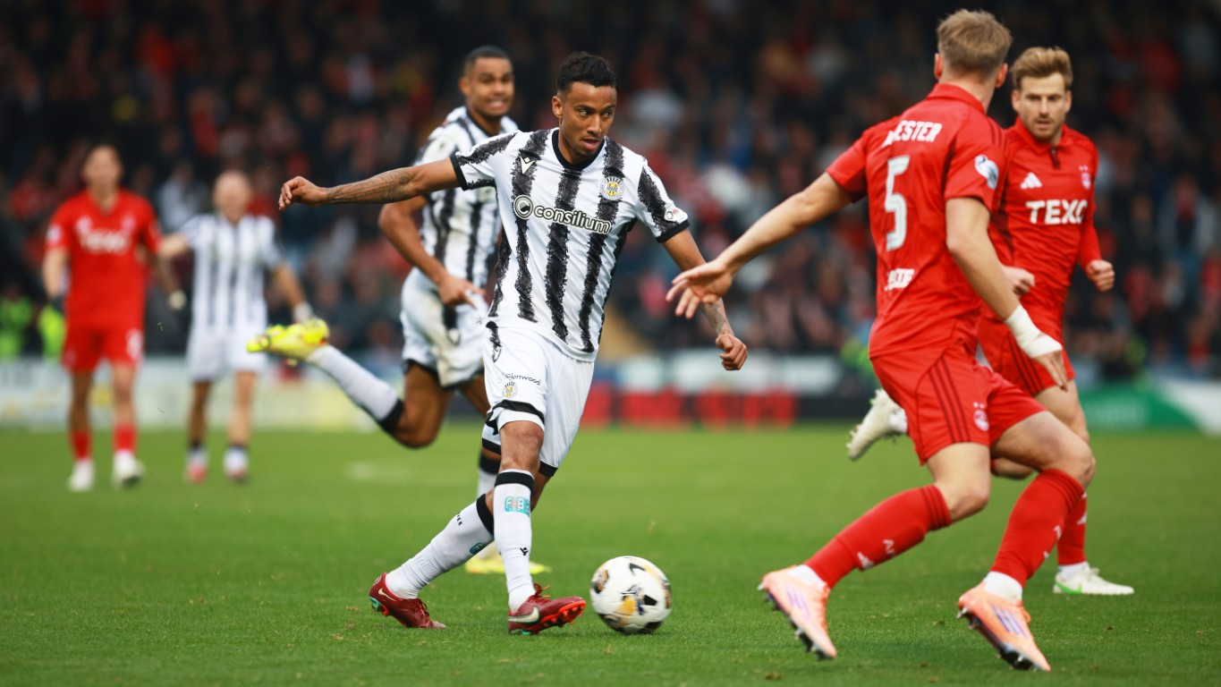 Saint's Keanu Baccus passes through the Aberdeen defence