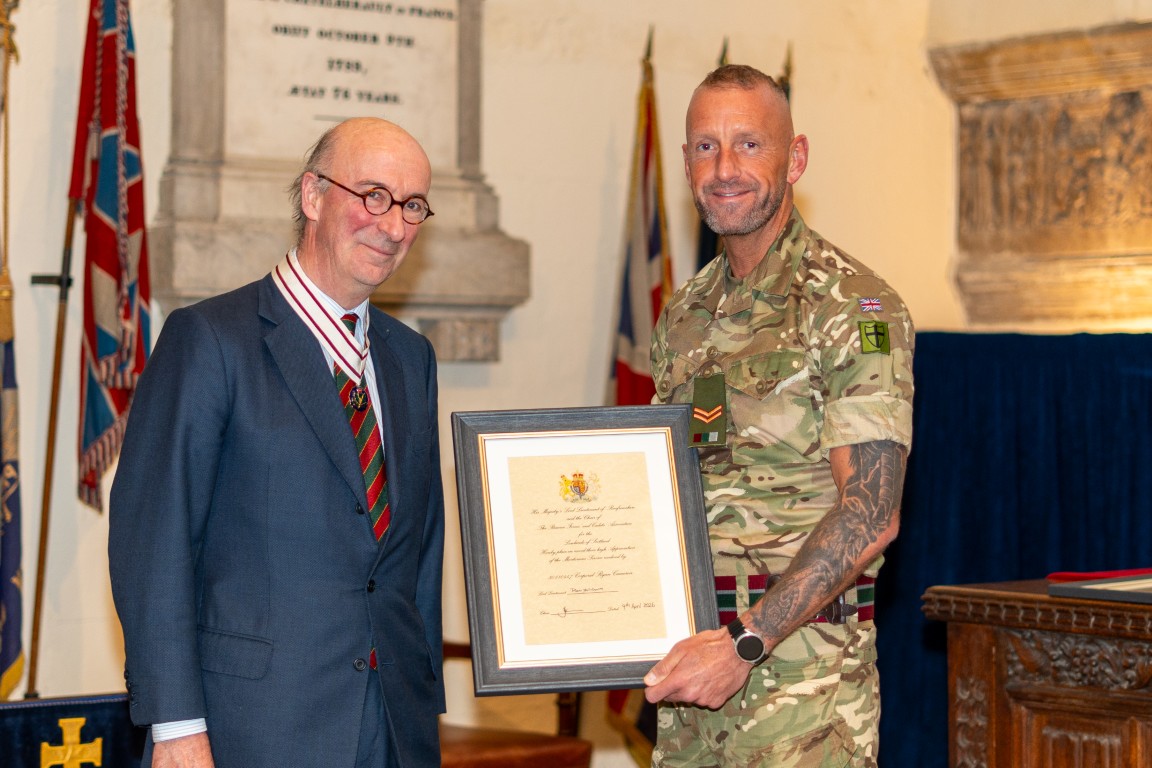 Corporal Bryan Cameron receiving his certificate from Vice Lord-Lieutenant David MacLellan
