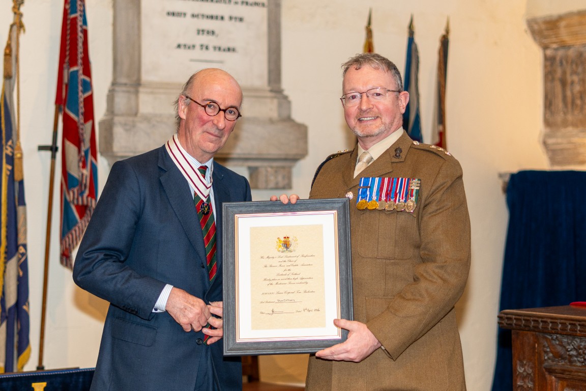 Lance Corporal Ian Buckton receiving his certificate from Vice Lord-Lieutenant David MacLellan