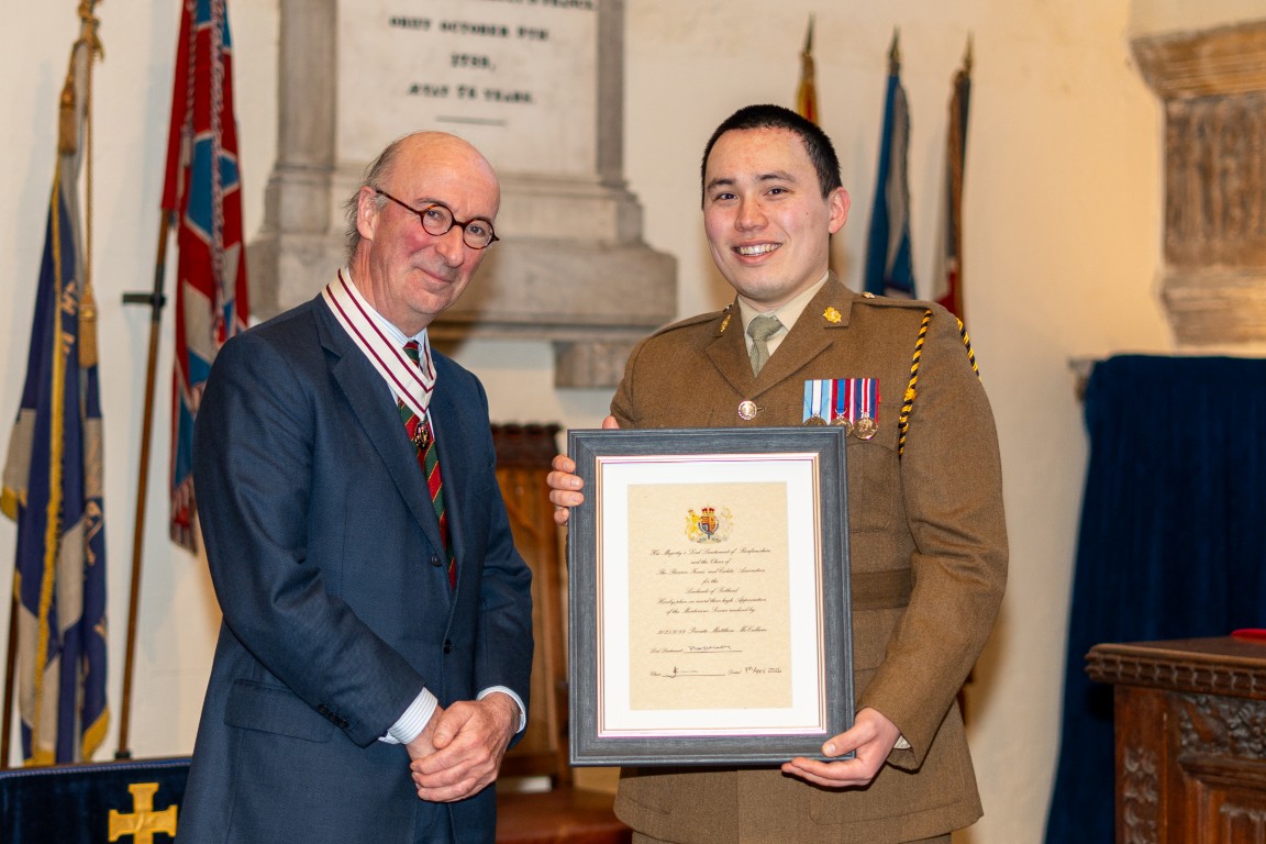 Private Matthew McCallum receiving his certificate from Vice Lord-Lieutenant David MacLellan