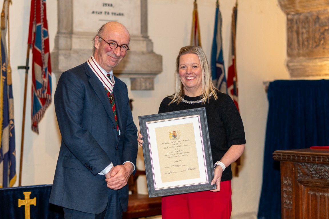 A certificate recipient receiving an award from Vice Lord-Lieutenant David MacLellan