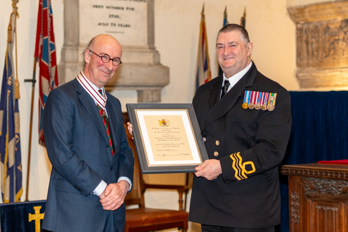Lieutenant Commander Peter McDonald receiving his certificate from Vice Lord-Lieutenant David MacLellan