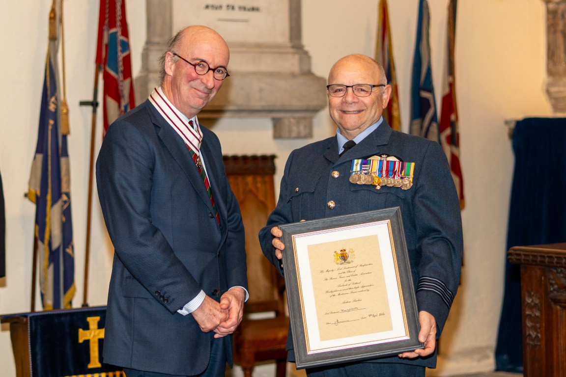 Andrew Lawless receiving his certificate from Vice Lord-Lieutenant David MacLellan