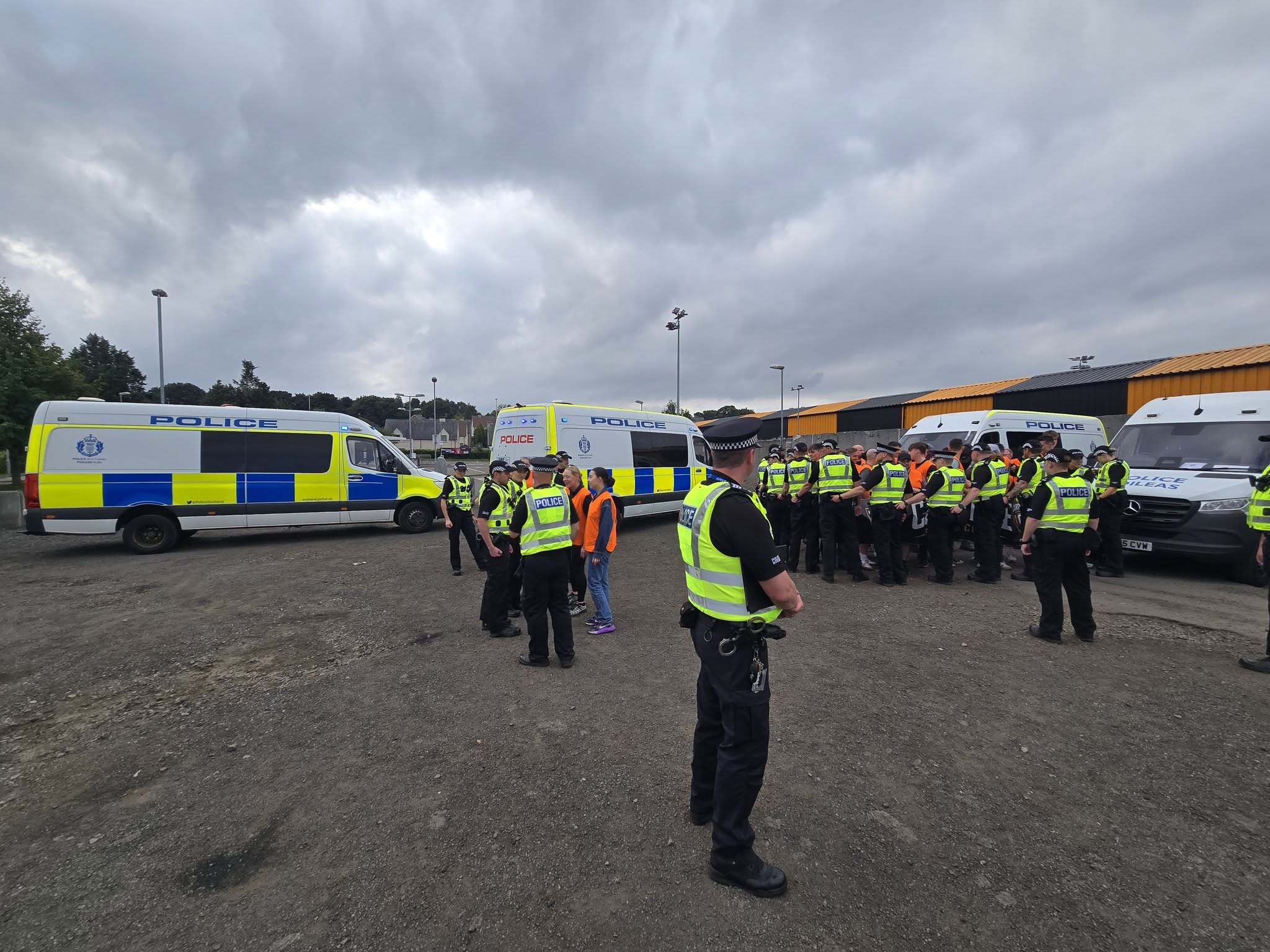 Probationary police officers taking part in a controlled training exercise