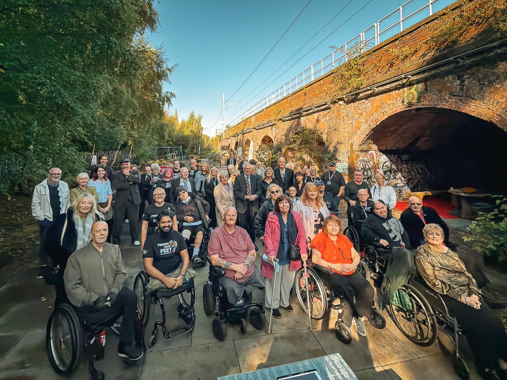 Group gathered in the Finding Your Feet Charity Hub Garden