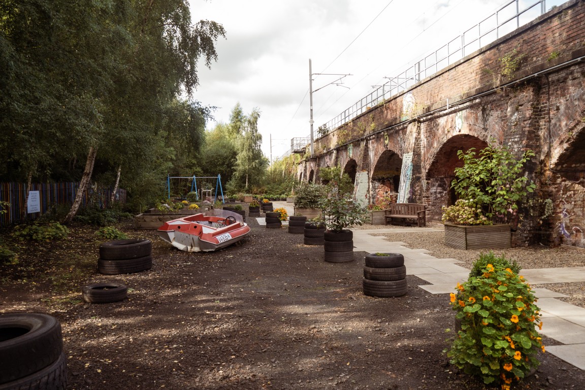 Garden space and railway arches at the Finding Your Feet Charity Hub