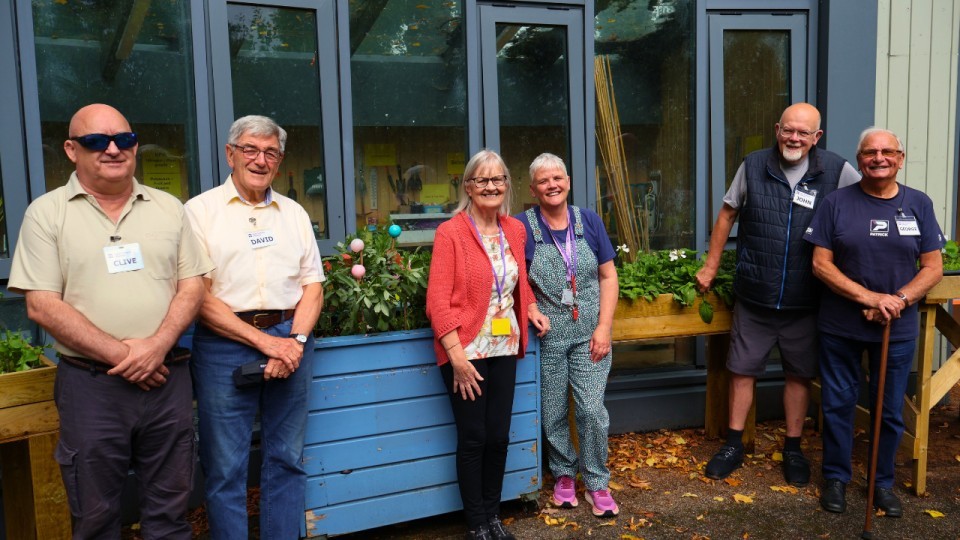 Veterans with Allison West in the garden at the Hawkhead Centre in Paisley