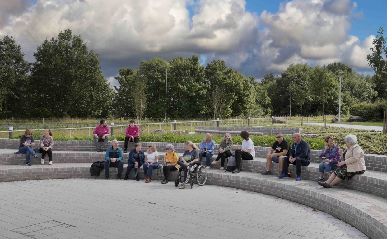 Residents sitting in the new Erskine civic plaza