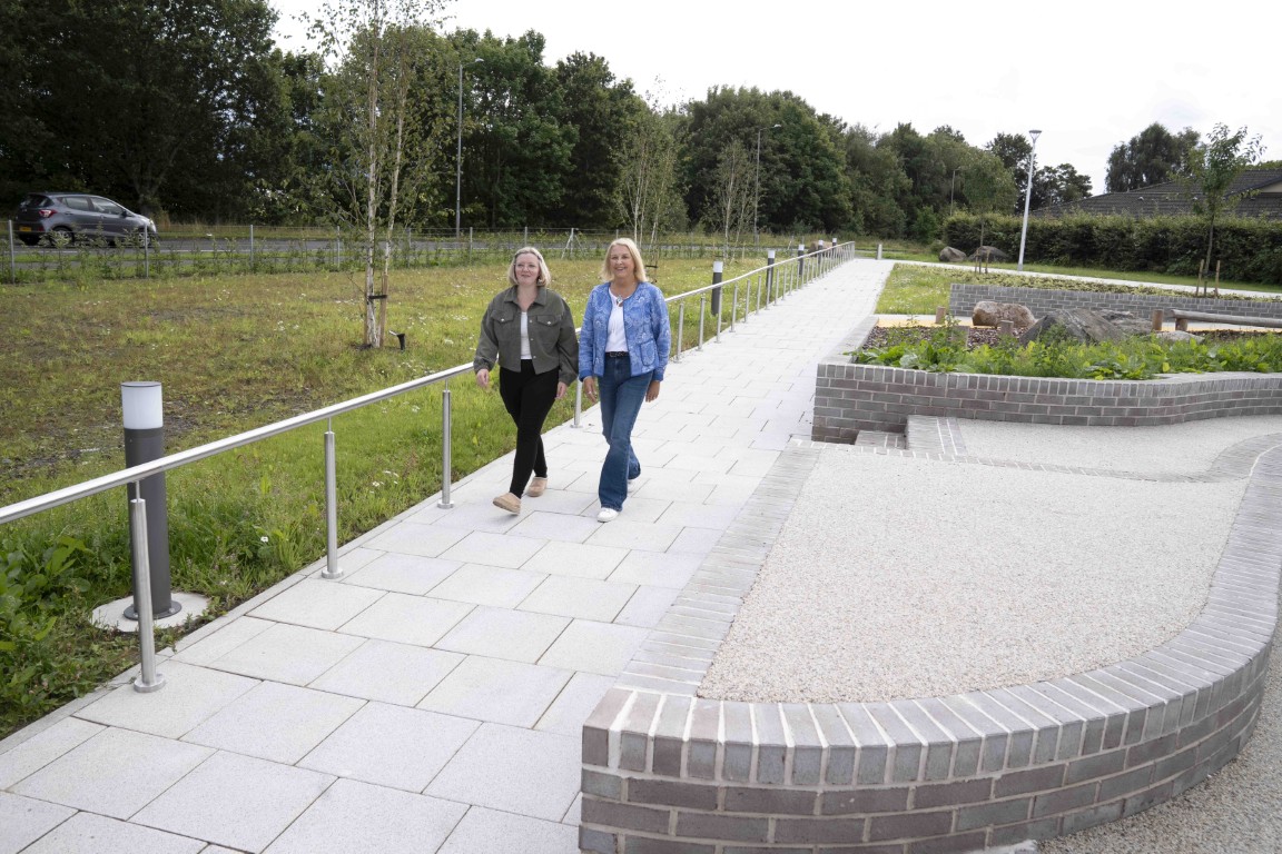 People walking through the new Erskine civic plaza