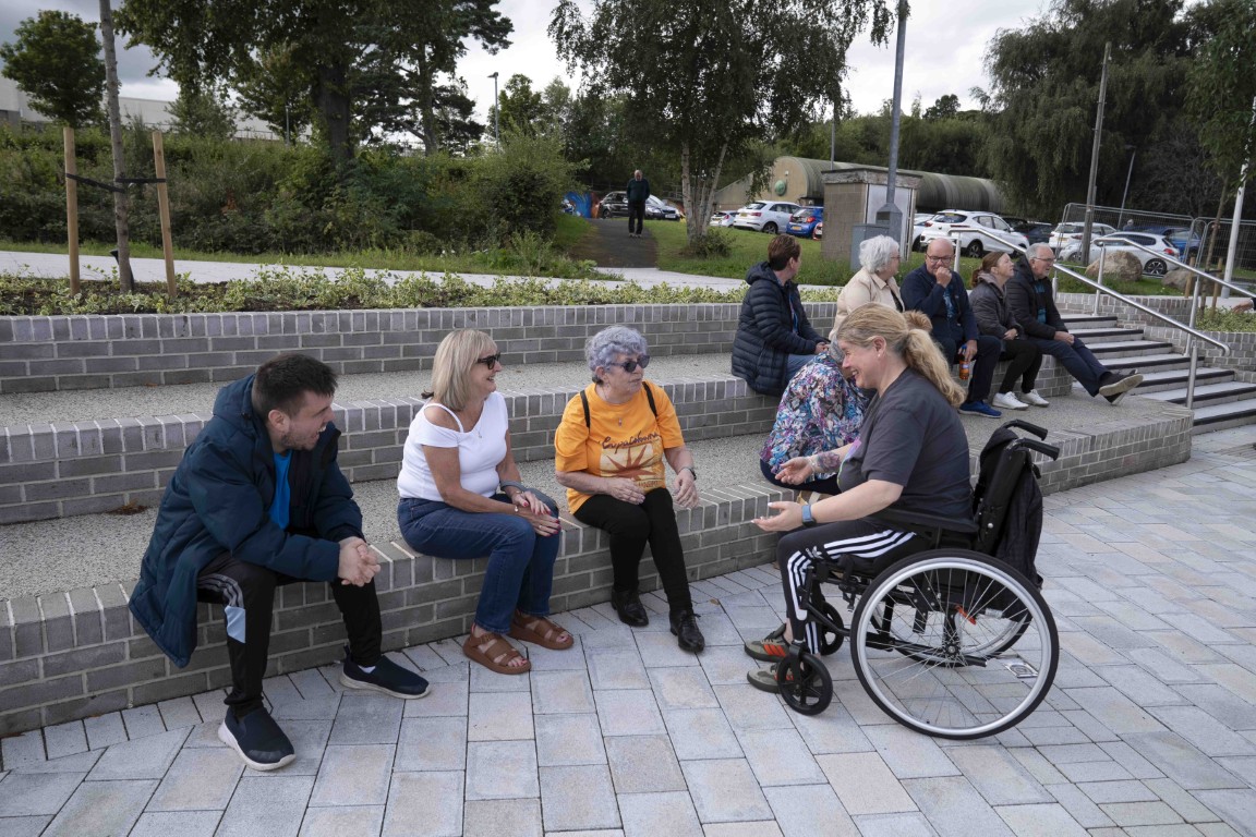 Residents talking in the new Erskine civic plaza