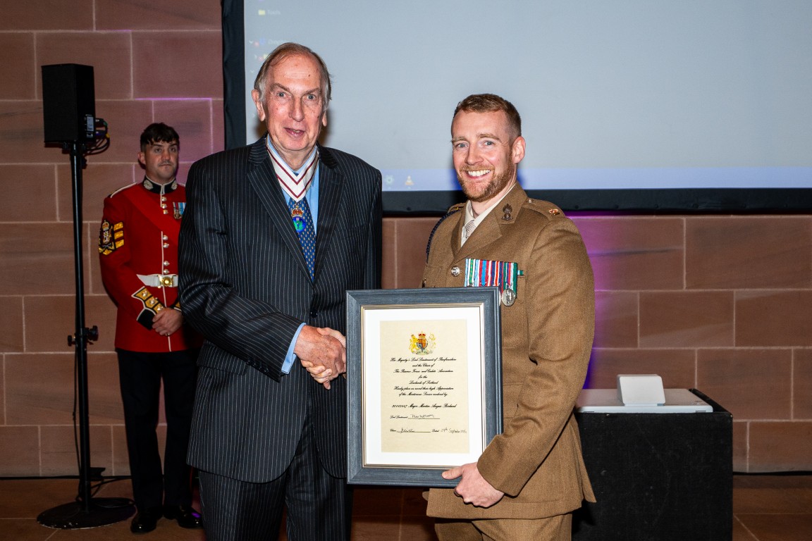 Major Martin Angus Borland receives his certificate from Colonel Peter McCarthy
