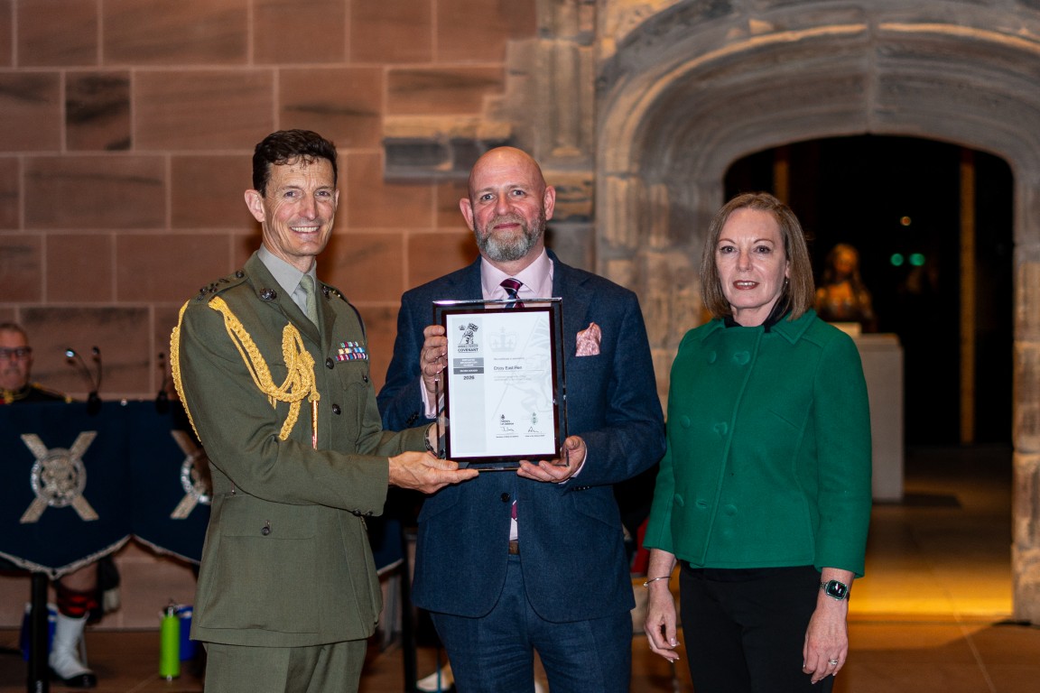 Anthony McReavy and Kirsty MacIntosh collect Enjoy East Ren's Silver Award from Brigadier Andy Muddiman