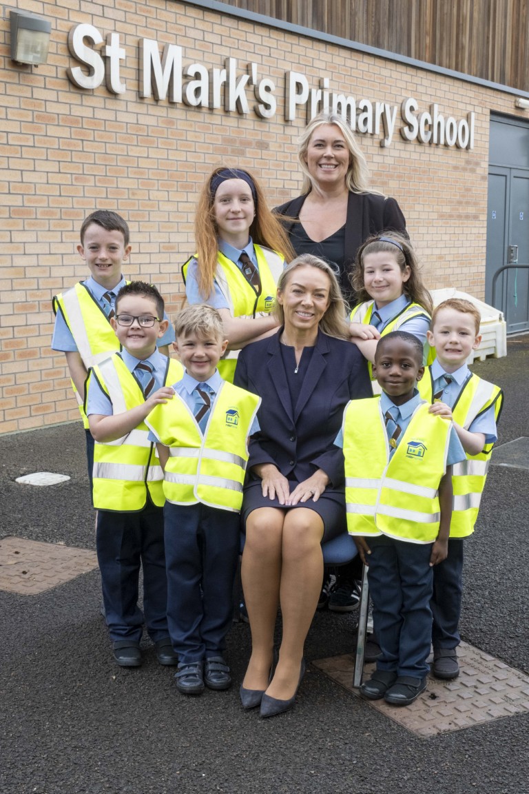 Pupils wearing high-visibility vests outside St Mark’s Primary School in Hamilton