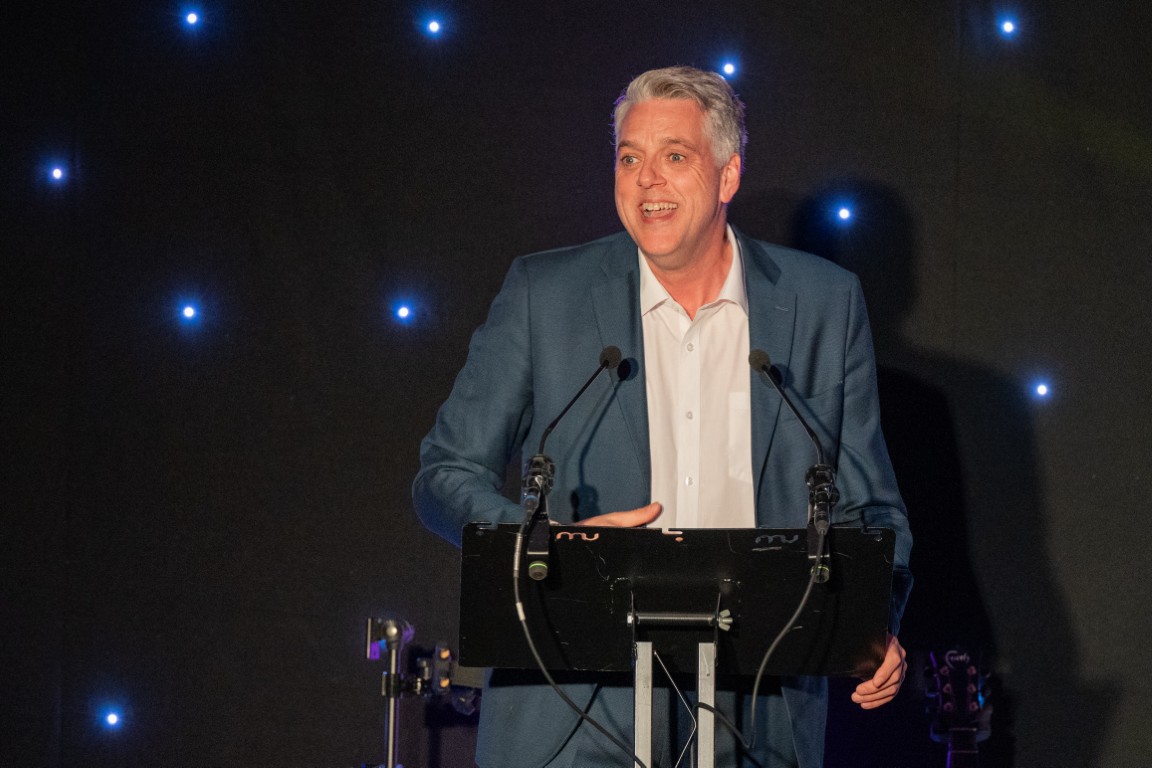 Broadcaster Iain Lee delivering his keynote address