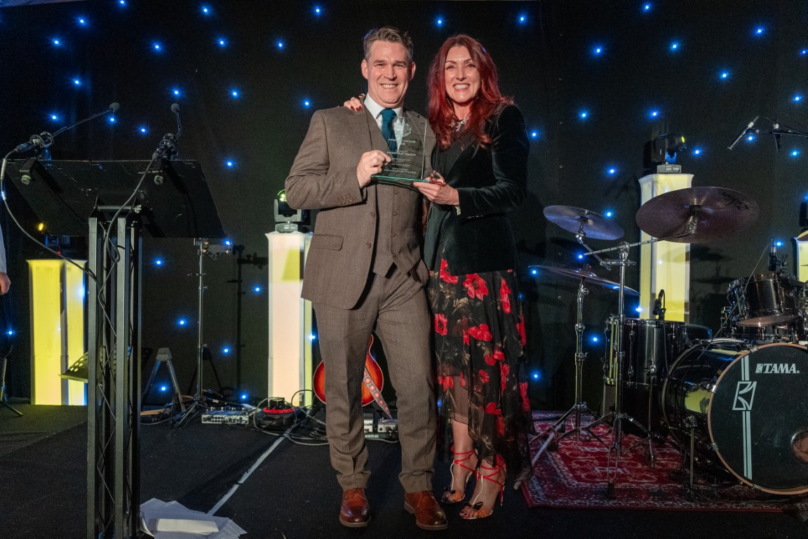 Richard ‘Tich’ Watson receiving the Recovery Champion Award from Gayle Brannigan